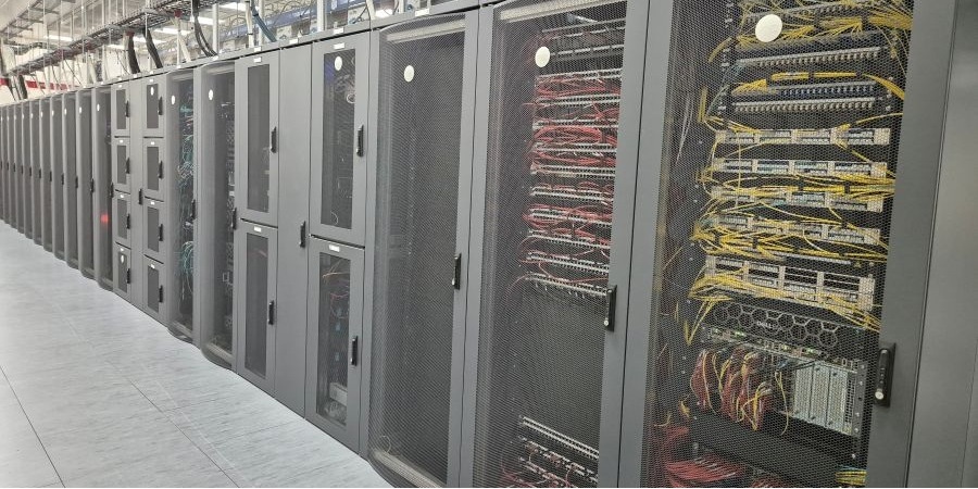 Row of racks inside nLighten Birmingham data centre BHX1